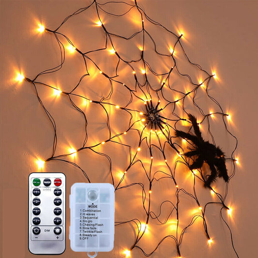 A 3ft black LED spider web light featuring 70 glowing lights and a realistic plush black spider with red eyes mounted on an outdoor wall.