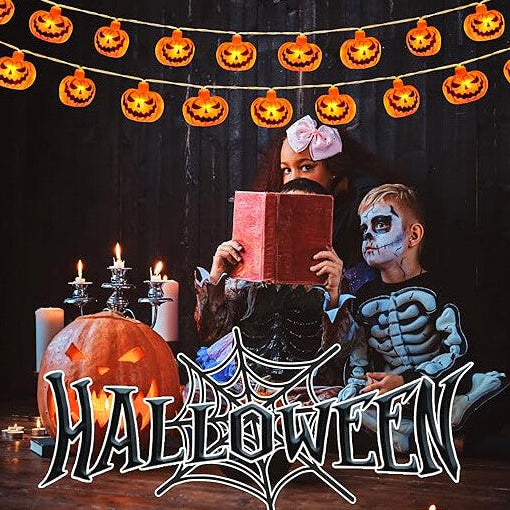 A 3M string of 20 3D pumpkin LED lights glowing with a warm orange light across a decorated indoor window.