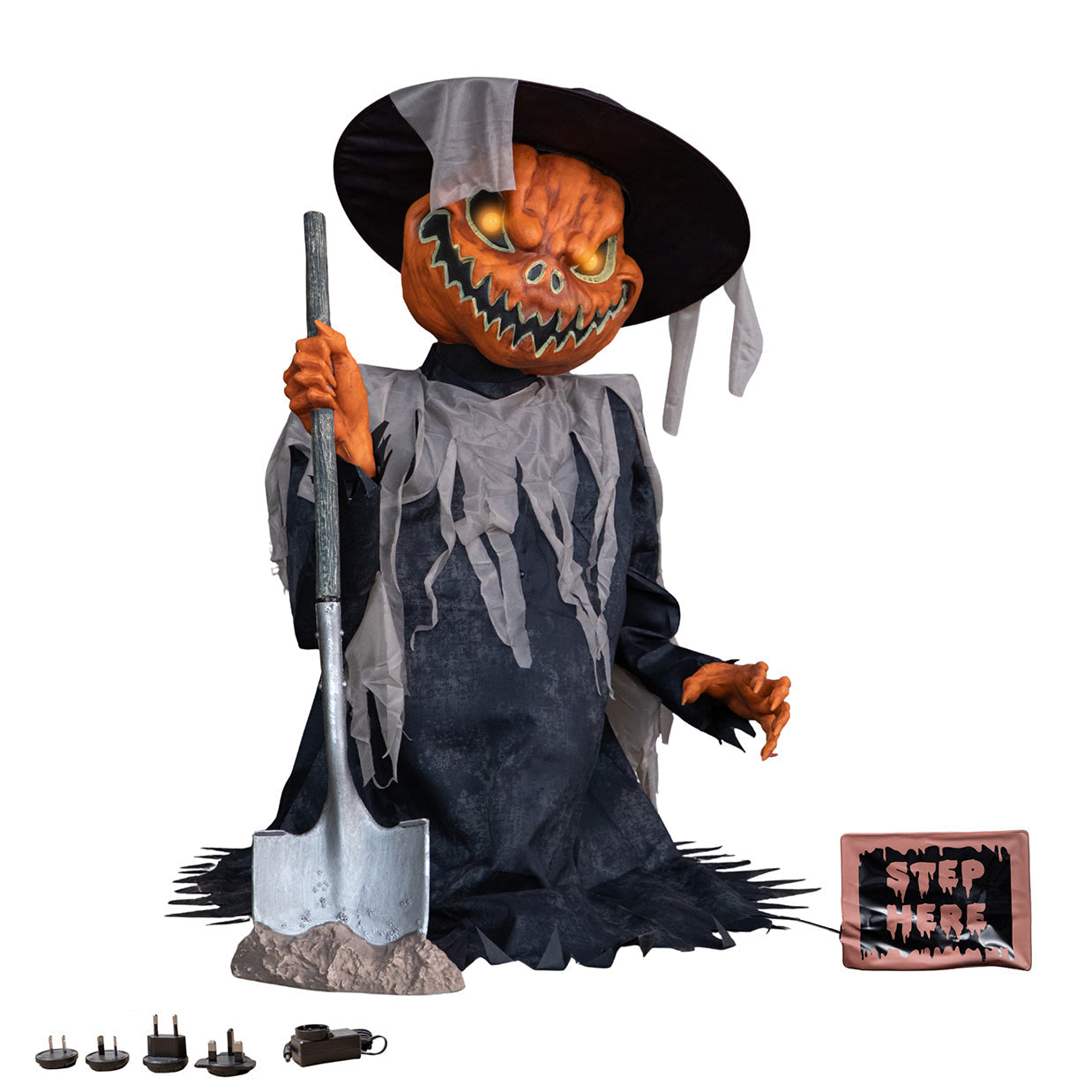 Front view of a 3ft pop-up pumpkin head scarecrow animatronic wearing a ragged brown tunic and hat with glowing orange LED eyes and red shovel light against a dark backdrop.