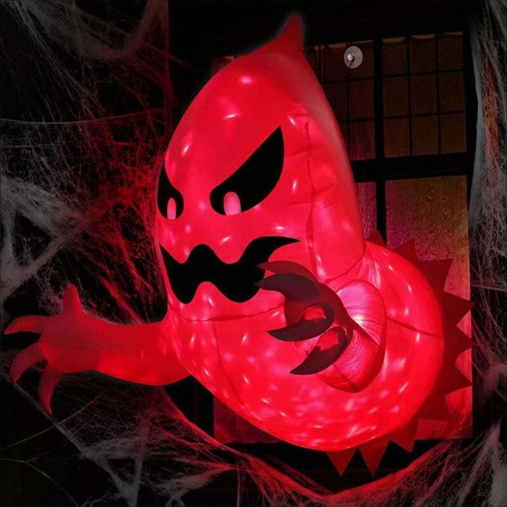 Side angle of a 4.5ft white inflatable Halloween ghost with red glowing internal LEDs mounted to a house window as if breaking out.Side angle of a 4.5ft white inflatable Halloween ghost with red glowing internal LEDs mounted to a house window as if breaking out.
