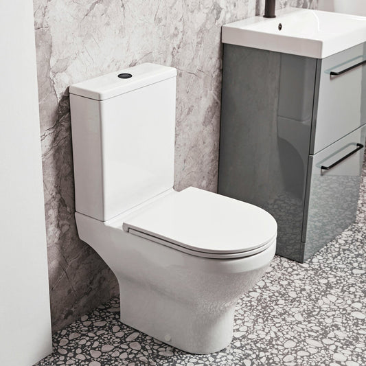 Tavistock Lindo rimless open back close coupled toilet with cistern and seat