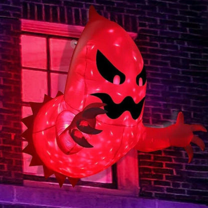 Side view of a 4ft white inflatable Halloween ghost with bright internal LED lights attached to a house window pane with suction cups.