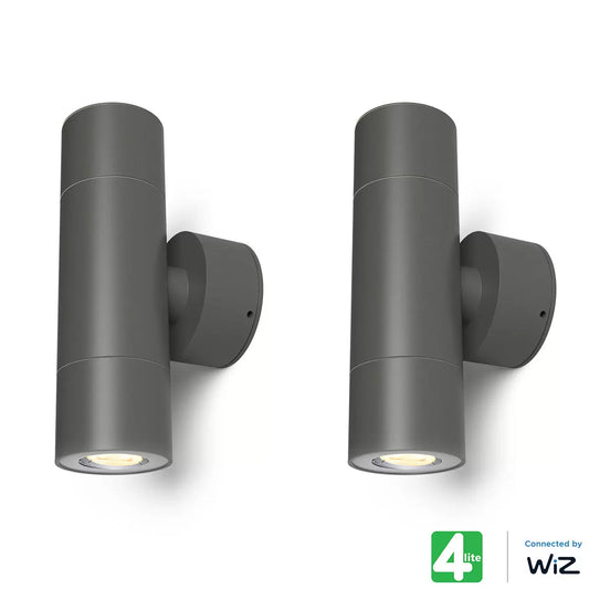 A 4lite bi-directional wall light in a textured dark grey finish mounted on a modern exterior wall, casting light both upwards and downwards.