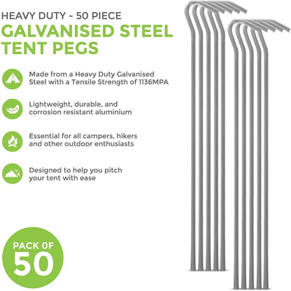 A bundle of fifty silver galvanised steel J-hook tent pegs arranged neatly on a patch of short green grass next to a set up camping tent.