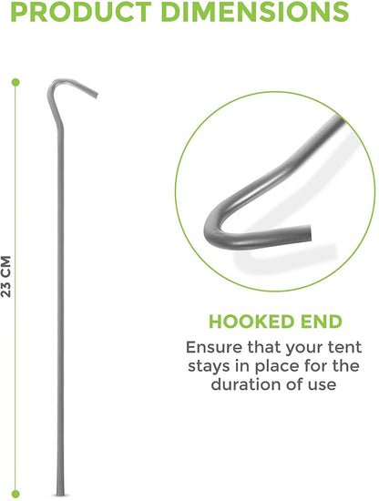 A bundle of fifty silver galvanised steel J-hook tent pegs arranged neatly on a patch of short green grass next to a set up camping tent.