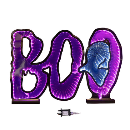 Samuel Alexander 60cm illuminated BOO infinity mirror sign with glowing pink and white LEDs mounted on a wooden base displayed on a fireplace mantel.