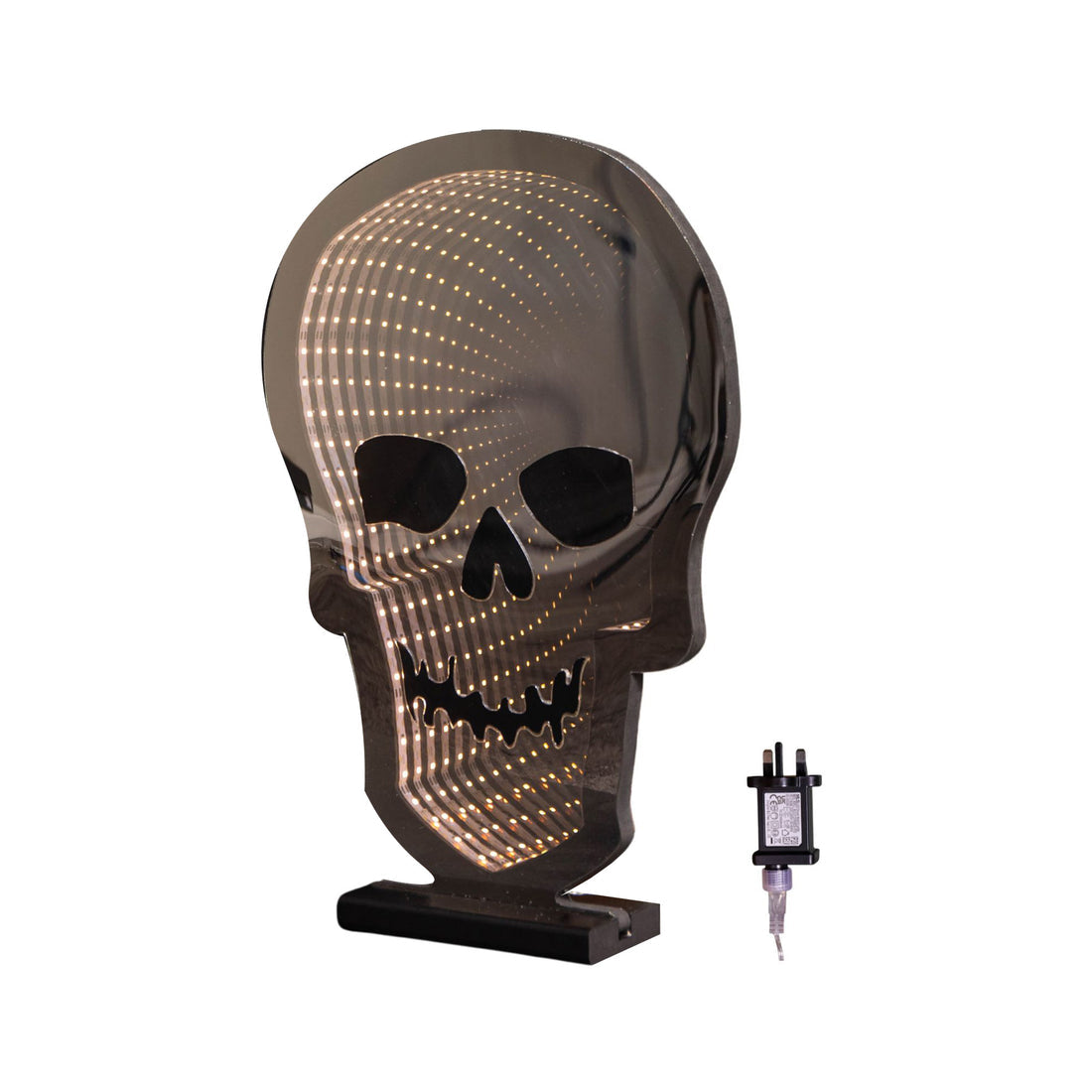 Samuel Alexander 60cm light up Halloween skull infinity light with warm white LEDs glowing on a wooden base in a darkened room setting.