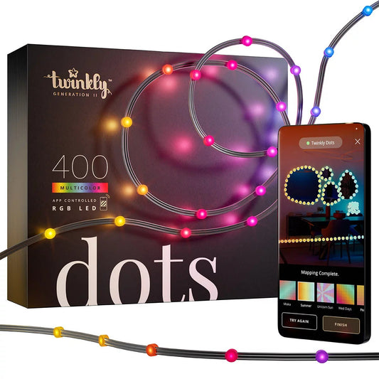 Black 20m Twinkly Dots strand with 400 miniaturized flat matte RGB LED lights glowing in vibrant multi-color hues along a wall.