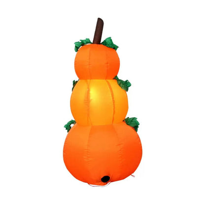 Front view of a 6-foot-tall orange inflatable Halloween pumpkin with glowing internal LEDs and a ghostly companion on a green garden lawn at night.