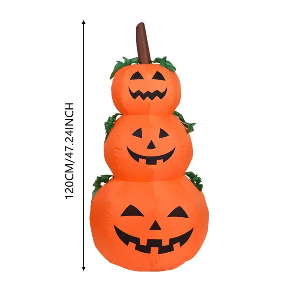 Front view of a 6-foot-tall orange inflatable Halloween pumpkin with glowing internal LEDs and a ghostly companion on a green garden lawn at night.