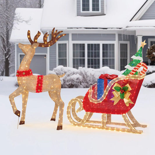 Large 6ft 3D Christmas reindeer and sleigh yard decoration illuminated with 675 colorful twinkling LED lights on a snowy lawn setting.
