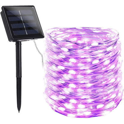 A 72ft string of 200 purple LED solar fairy lights glowing brightly wrapped around an outdoor garden tree at night.