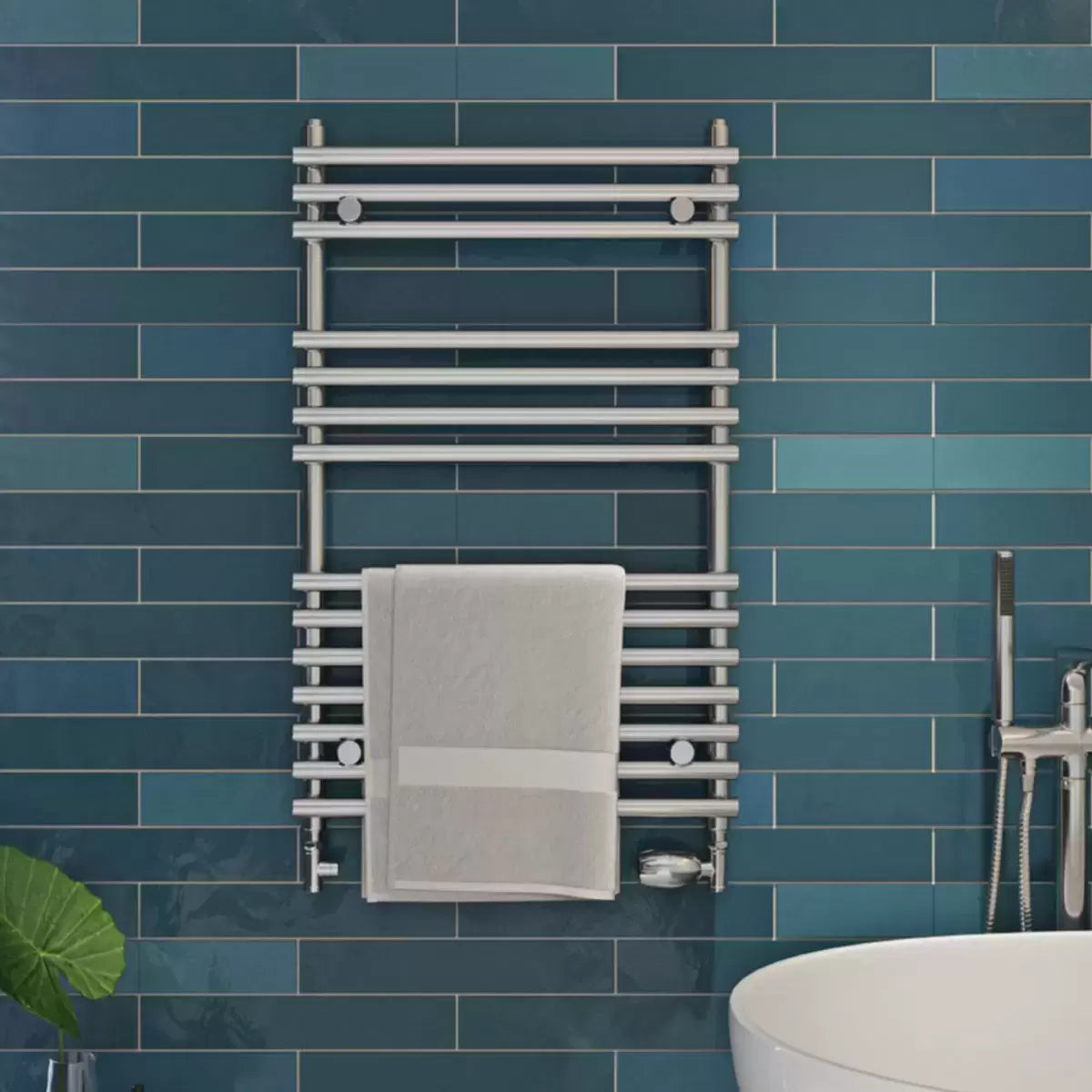 Front view of the contemporary Ultraheat Windsor radiator in a modern tiled bathroom setting, displaying 14 horizontal bars for towel warming.