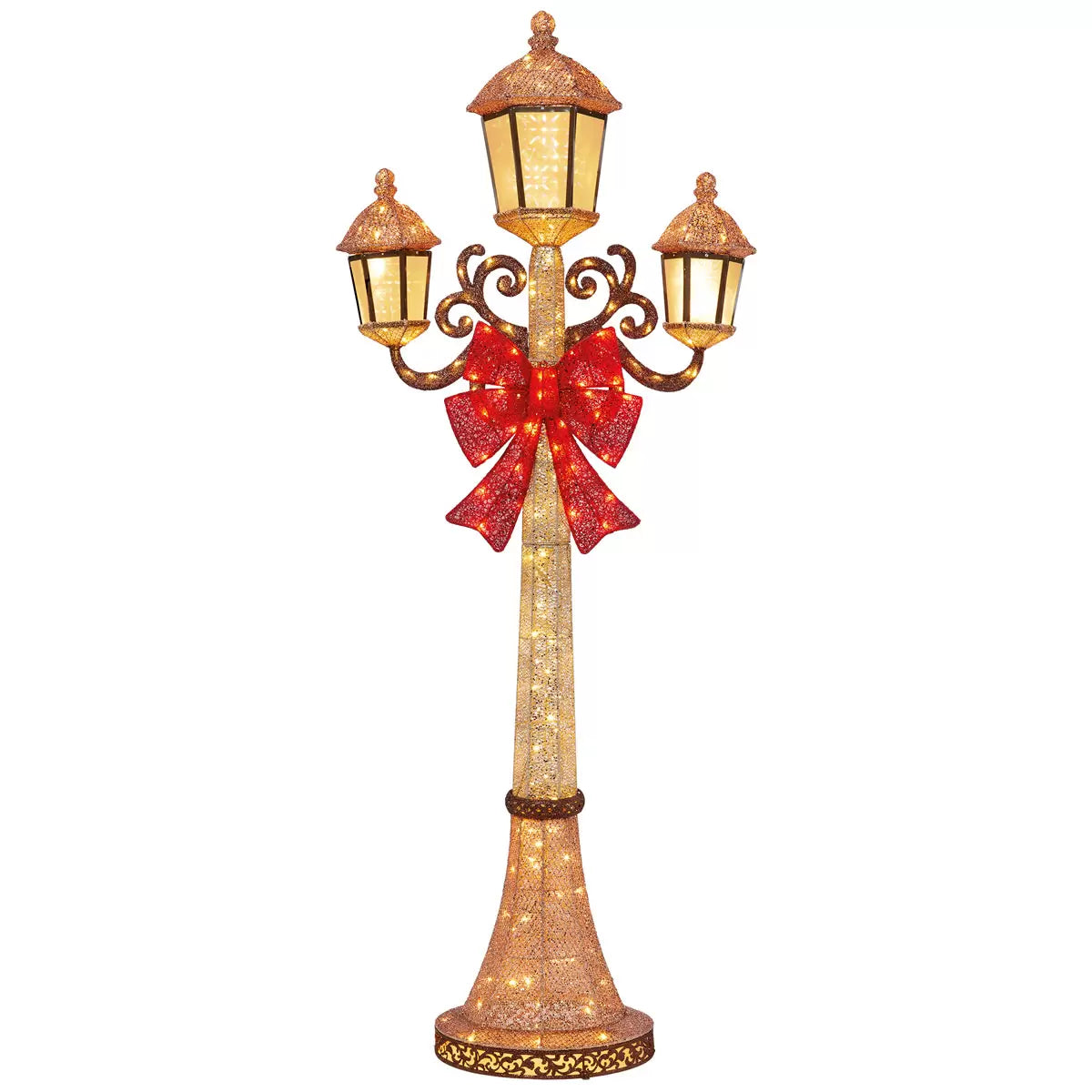 Front view of a black 7ft Puleo Christmas lamp post illuminated with warm white LED lights standing outdoors on a patio at dusk.