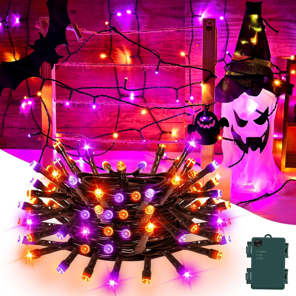 A 9.84ft string of 30 orange and purple LED Halloween fairy lights glowing brightly on an outdoor porch railing at night.