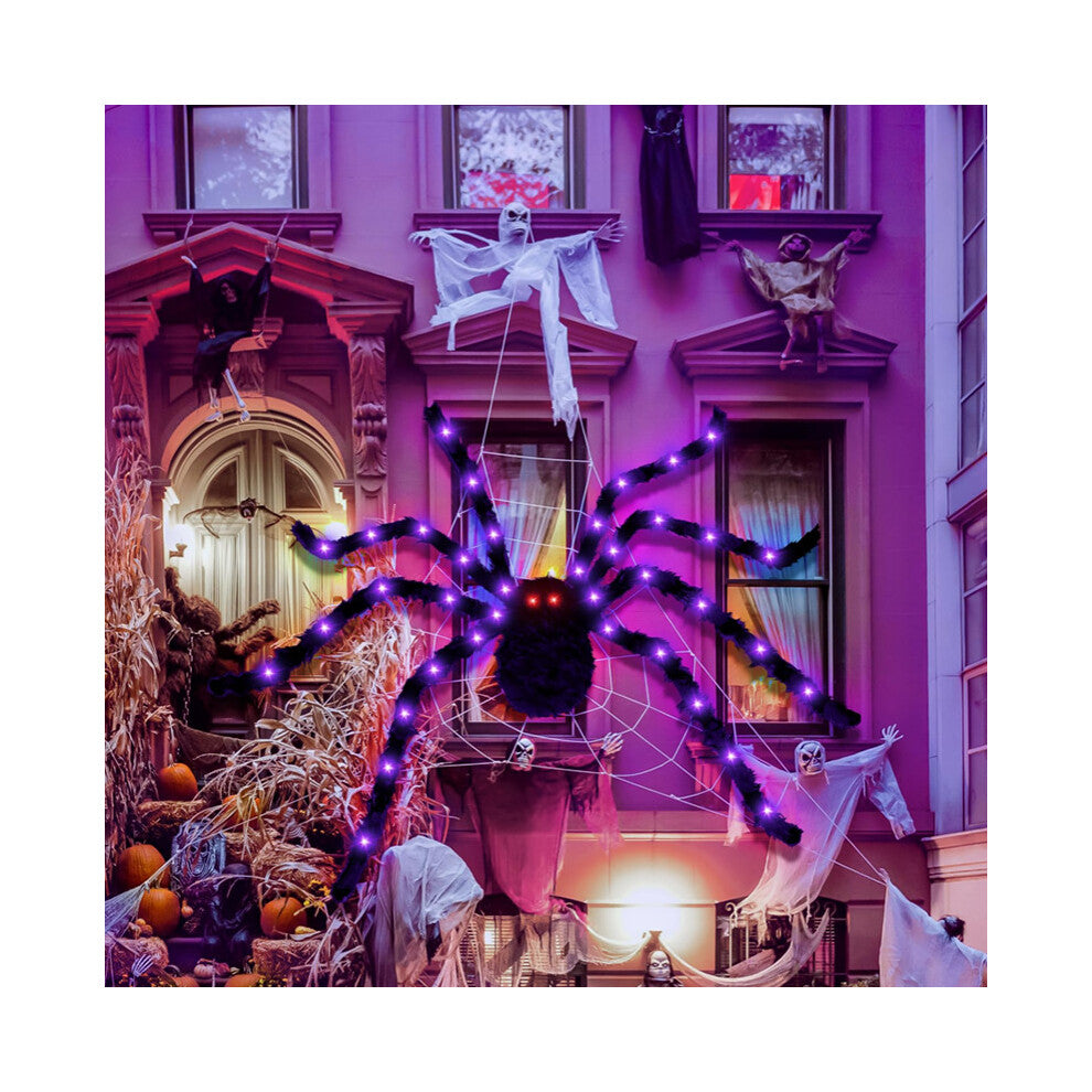 A 90cm black hairy Halloween spider decoration with glowing LED lights on its eyes and legs, positioned on a spooky web backdrop.