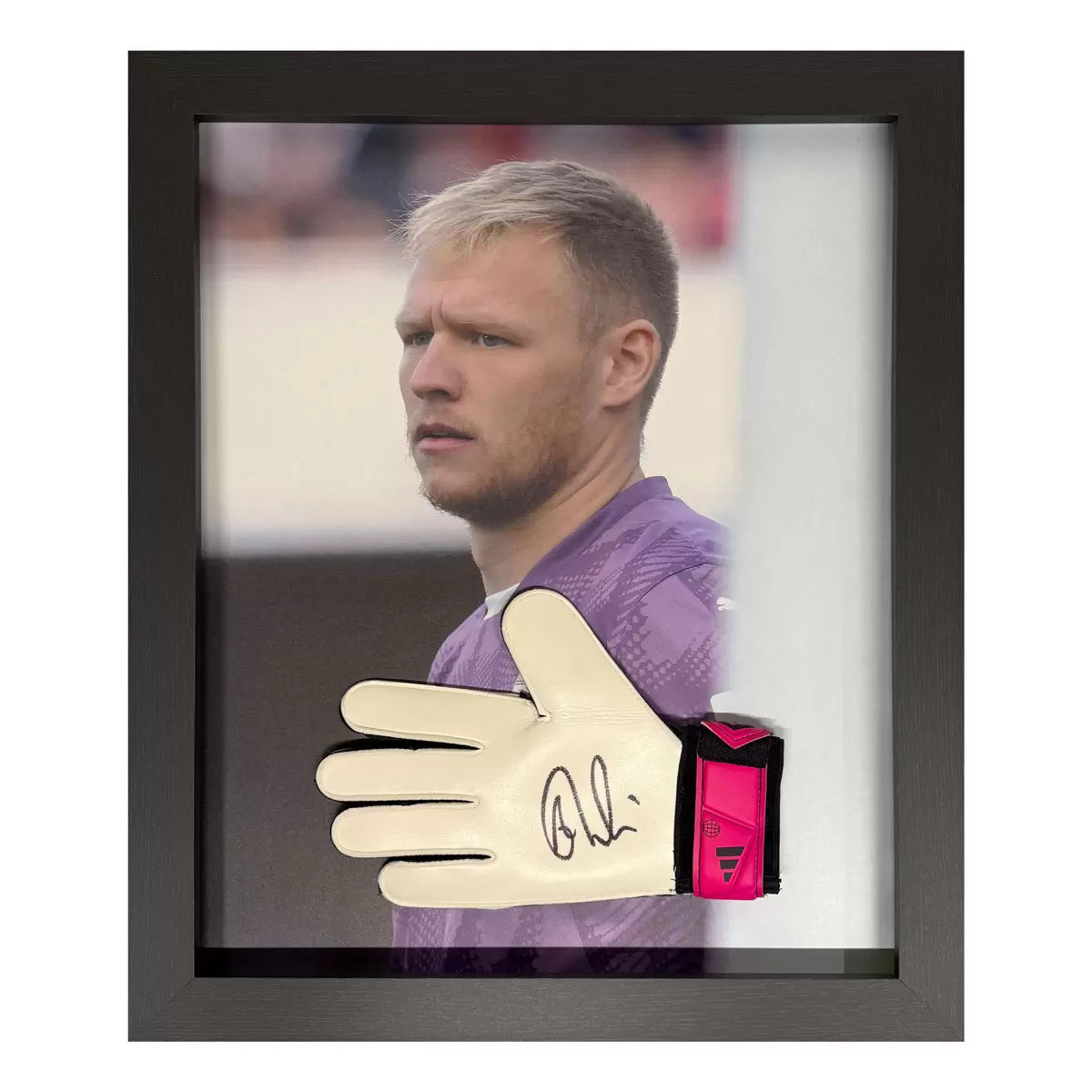 A professional, wall-mounted display case featuring an authentic Adidas goalkeeper glove signed by Aaron Ramsdale, set against a clean, neutral backing.