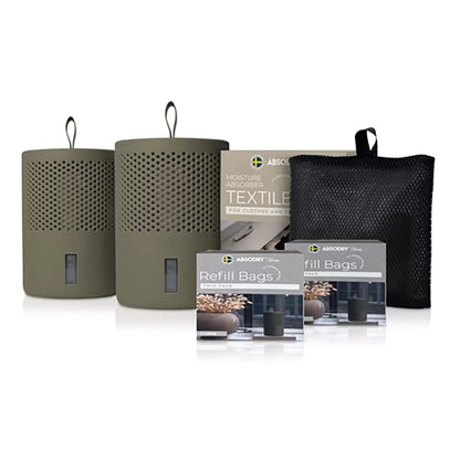 Front view of the minimalist Scandinavian Absodry Moisture Absorber unit next to a 600g refill pack and hanging textile wardrobe bag on a clean shelf.