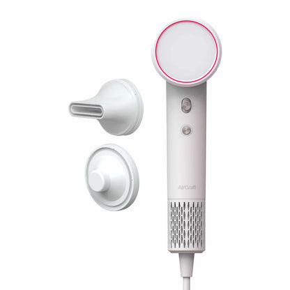 AirCraft Airmotion Ionic hair dryer in a sleek finish, shown with the magnetic styling nozzle and wall mount storage solution.