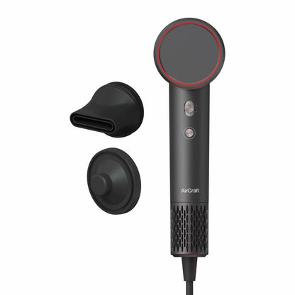 AirCraft Airmotion Ionic hair dryer in a sleek finish, shown with the magnetic styling nozzle and wall mount storage solution.