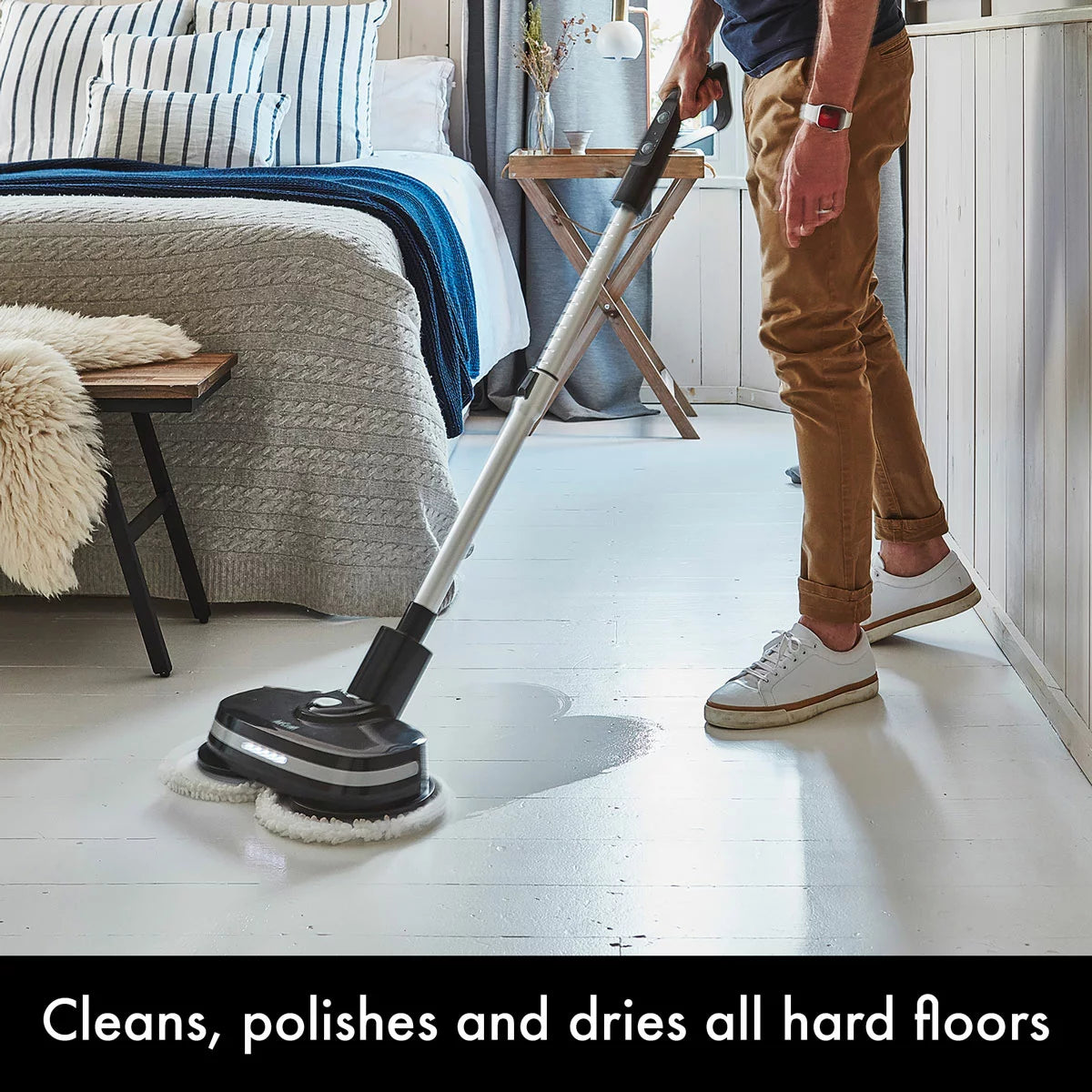 AirCraft PowerGlide cordless hard floor cleaner and polisher in black with extra cleaning pads for sealed floors.