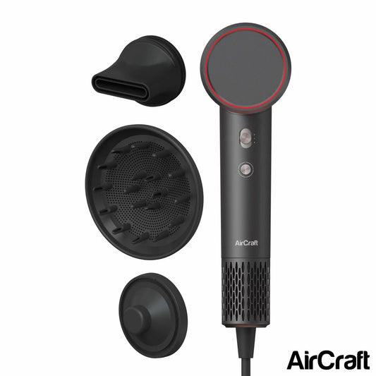 Side profile of the grey AirMotion Ionic hair dryer with its magnetic styling nozzle attached, set against a clean, modern bathroom background.