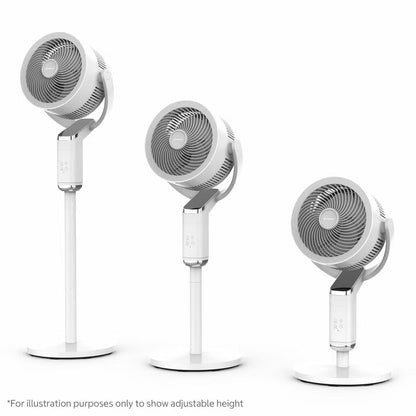 Modern white Airmate FA20-RD239 pedestal fan featuring a sleek slanted smart display screen, vertical support pole, and round base set in a sunlit living room.