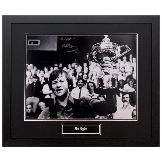 A professionally framed black and white action photograph of snooker legend Alex Higgins, featuring a clear hand-signature and a sleek, dark-wood frame.