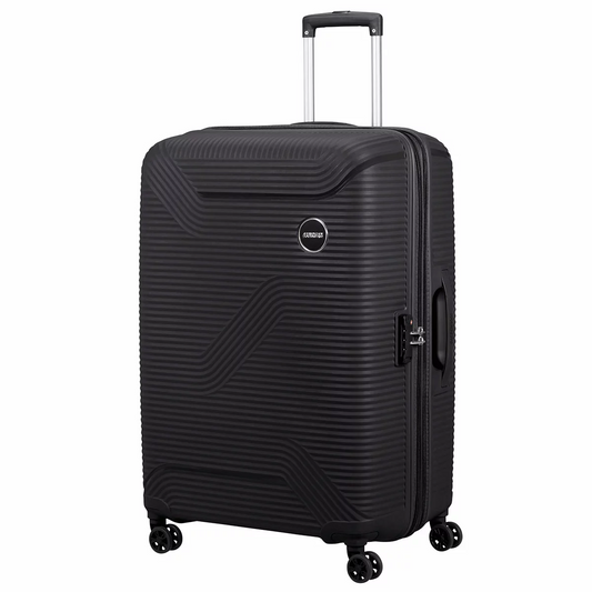 Front three-quarter view of the American Tourister Bonjoy 79cm hardside spinner case in Sage Green showcasing its textured polypropylene shell, chrome logo, and double spinner wheels.