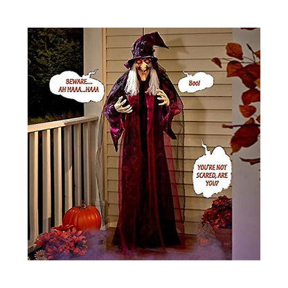 Hanging life-size Halloween animatronic witch in black yellow robes with glowing red LED eyes and grey hair.