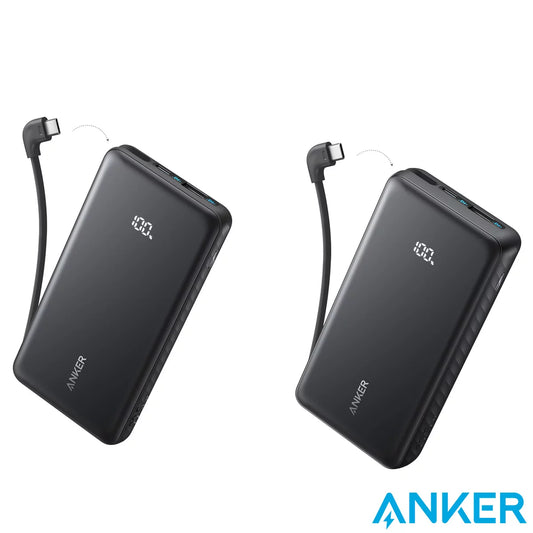 Top-down studio shot of the black Anker Zolo 20,000mAh power bank on a concrete desk, showing its glowing digital percentage screen and neatly tucked integrated green-accented USB-C cable.