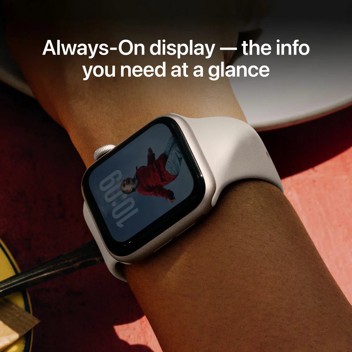 Front view of the Apple Watch SE 3 40mm Starlight Aluminium Case with matching Starlight Sport Band displaying the Vitals app on the Always-On screen.