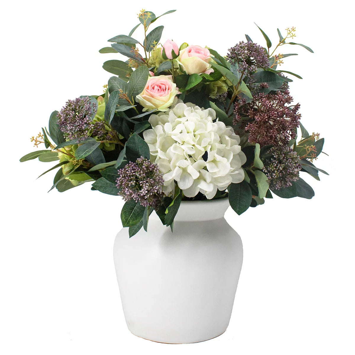 Front view of artificial summer bouquet featuring white roses and hydrangeas with eucalyptus leaves in a sleek white bowl vase on a wooden table.