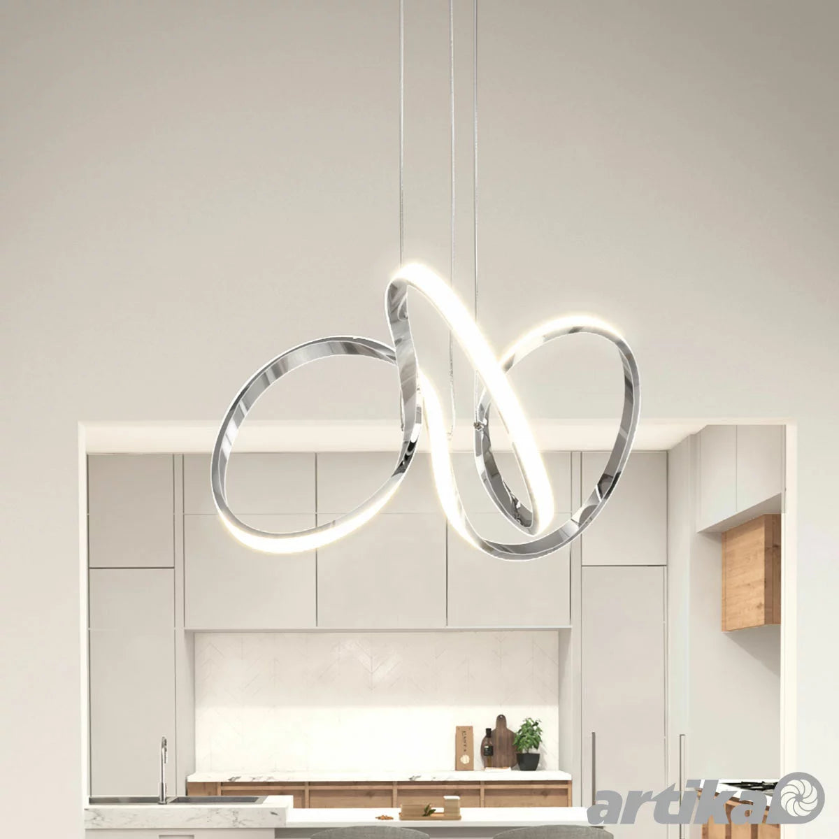 Modern Artika Swirl LED Pendant Light with sculptural chrome swirl design for contemporary kitchen and dining room lighting