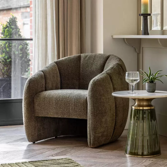 Front view of the Gallery Atella moss green bouclé tub chair, showcasing its vertical stitching details, rounded frame, and highly textured fabric.
