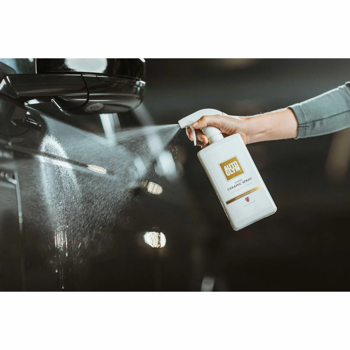 Autoglym Essential Bodywork and Wheels Collection Kit featuring five 500ml detailing bottles neatly arrayed next to a glossy car bumper.