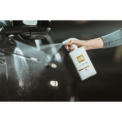 Autoglym Essential Bodywork and Wheels Collection Kit featuring five 500ml detailing bottles neatly arrayed next to a glossy car bumper.