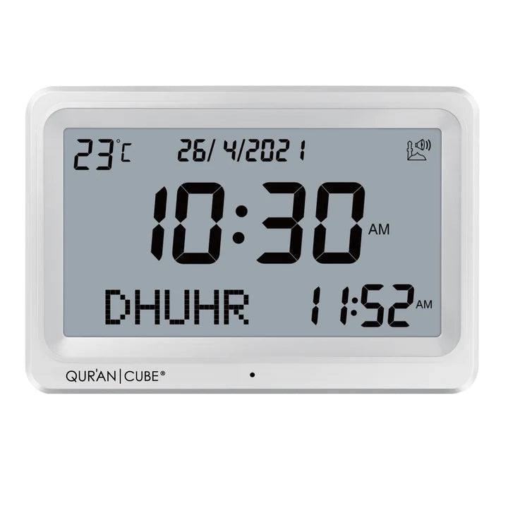 Front view of the black digital Adhan clock resting on its table stand, displaying the time, current room temperature, and calculated prayer schedules in crisp digital numbers.
