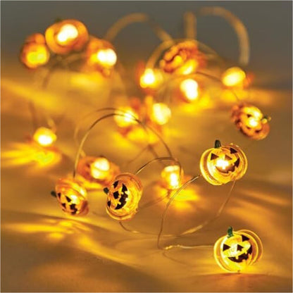 A 1.5-meter Baker Ross acrylic pumpkin string light glowing with a warm orange light inside a clear glass mason jar.