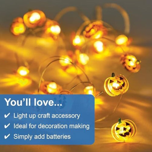 A 1.5-meter Baker Ross acrylic pumpkin string light glowing with a warm orange light inside a clear glass mason jar.