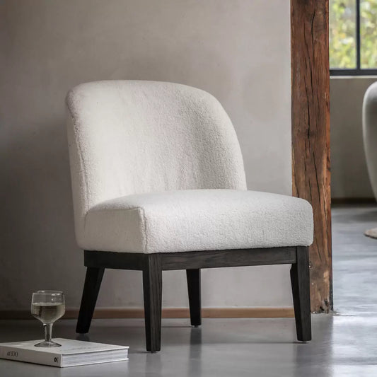 Front view of the Gallery Bardfield cream teddy fabric chair showcasing its textured boucle upholstery and light solid oak legs in a brightly lit room.