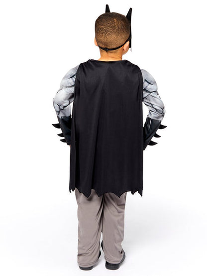 Front view of the kids Batman Muscle Chest Costume featuring molded foam armor torso and attached black cape on a neutral background.