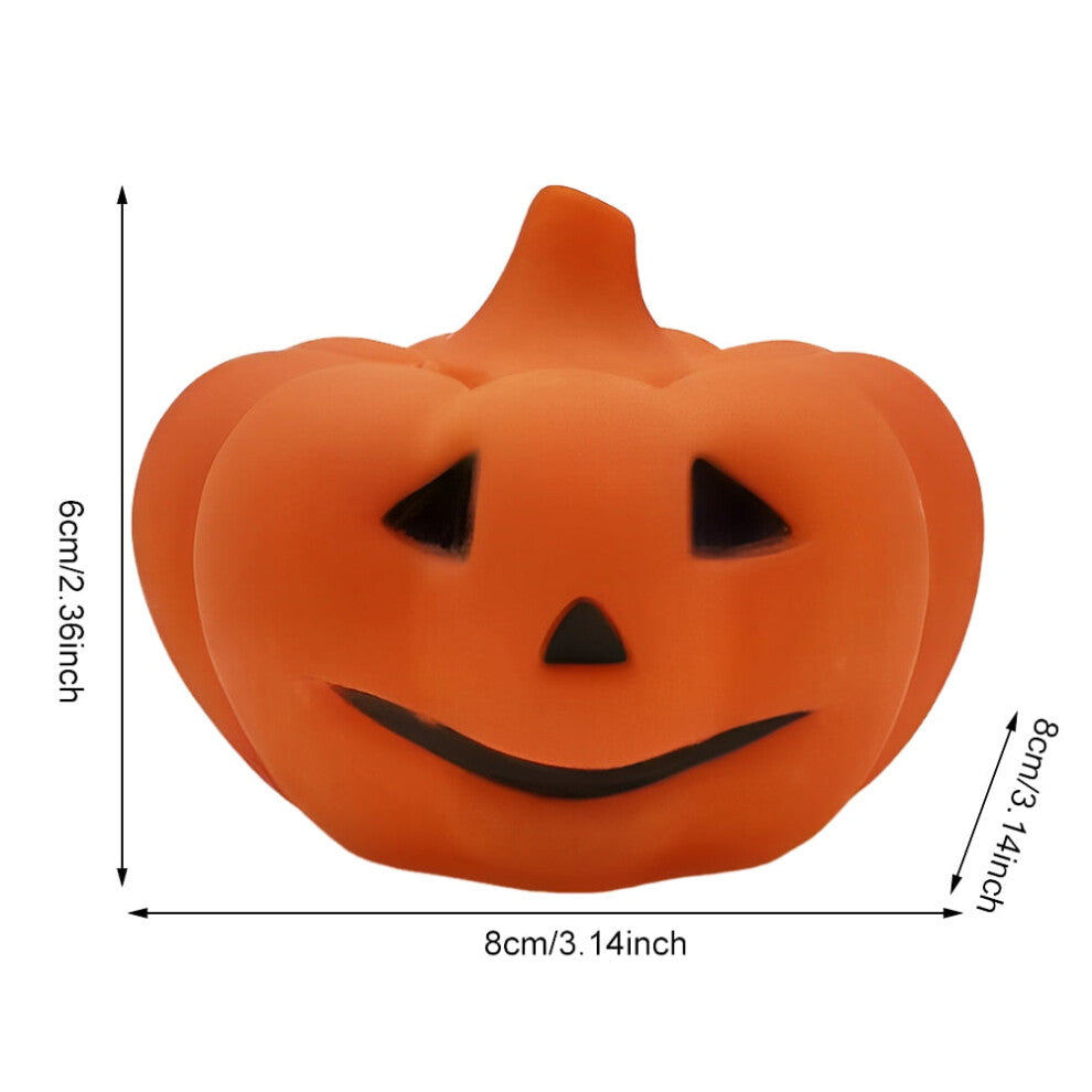 A soft silicone LED pumpkin nightlight glowing gently on a child's bedside table with a cozy orange light.