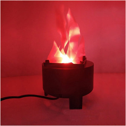 A Behogar simulated LED flame lamp glowing with a realistic flickering fire illusion on a dark Halloween party table.
