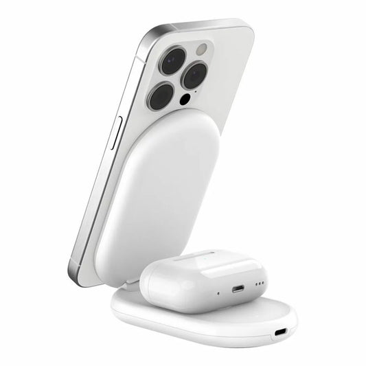 A side angle view of a sleek black Belkin 2-in-1 foldable charging stand holding a smartphone magnetically in landscape mode on a clean desk surface.