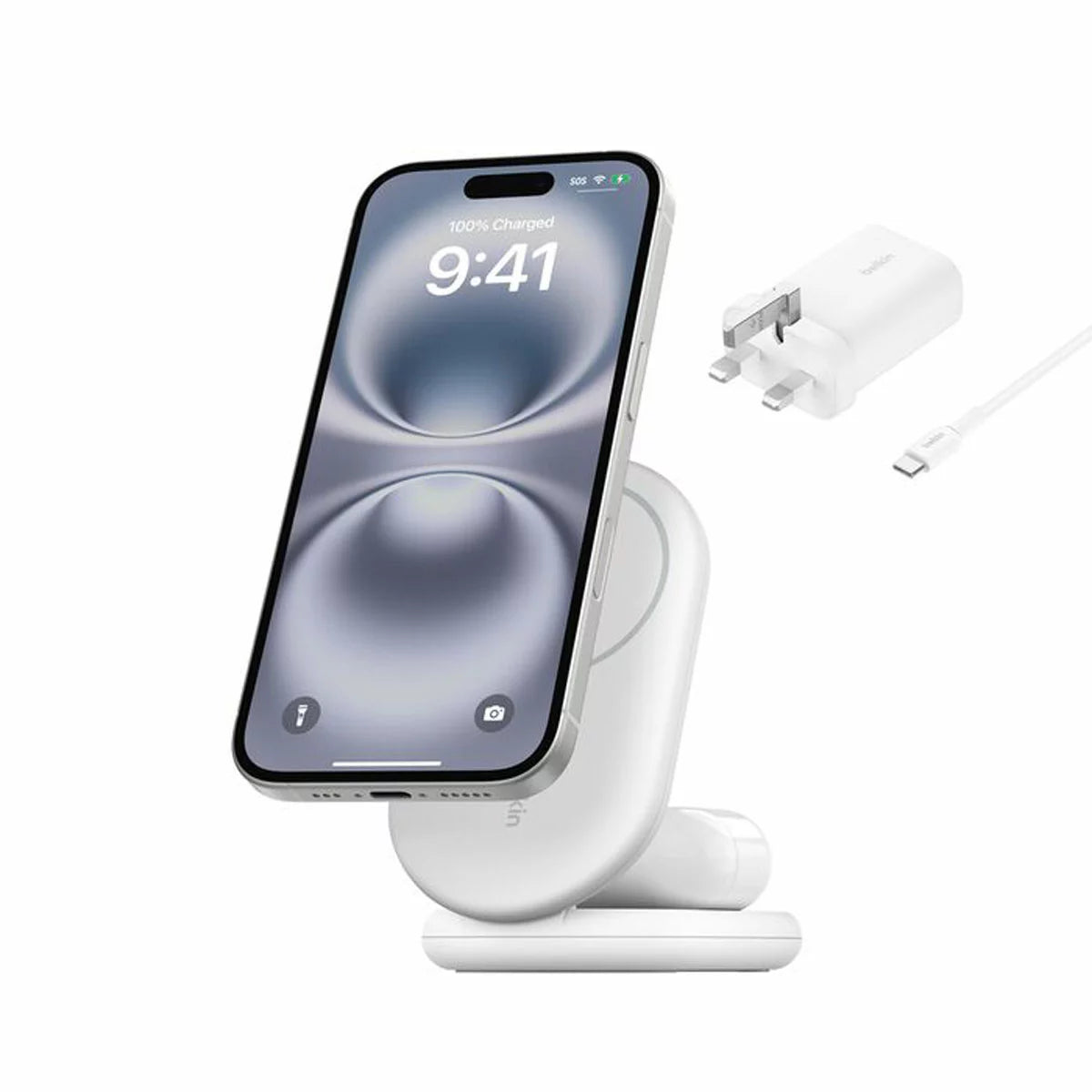 A side angle view of a sleek black Belkin 2-in-1 foldable charging stand holding a smartphone magnetically in landscape mode on a clean desk surface.