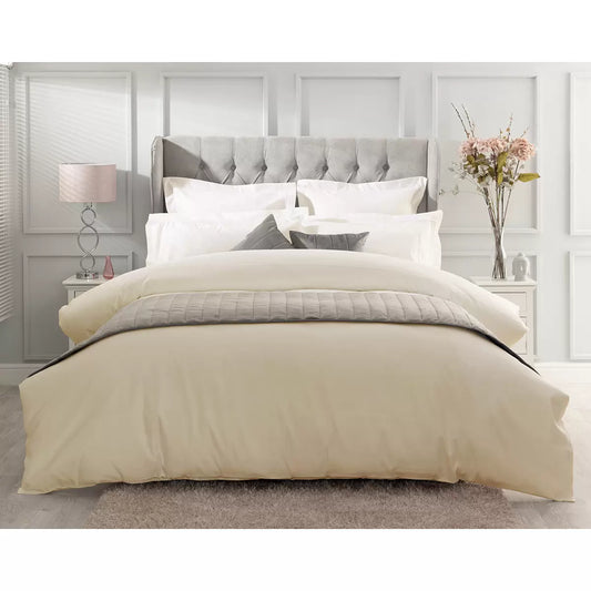 Close-up shot of the Belledorm 1000 thread count pure Egyptian cotton sateen bedding bundle in soft ivory, showing the smooth, lustrous drape of the duvet cover and matching pillowcases on a dressed bed.