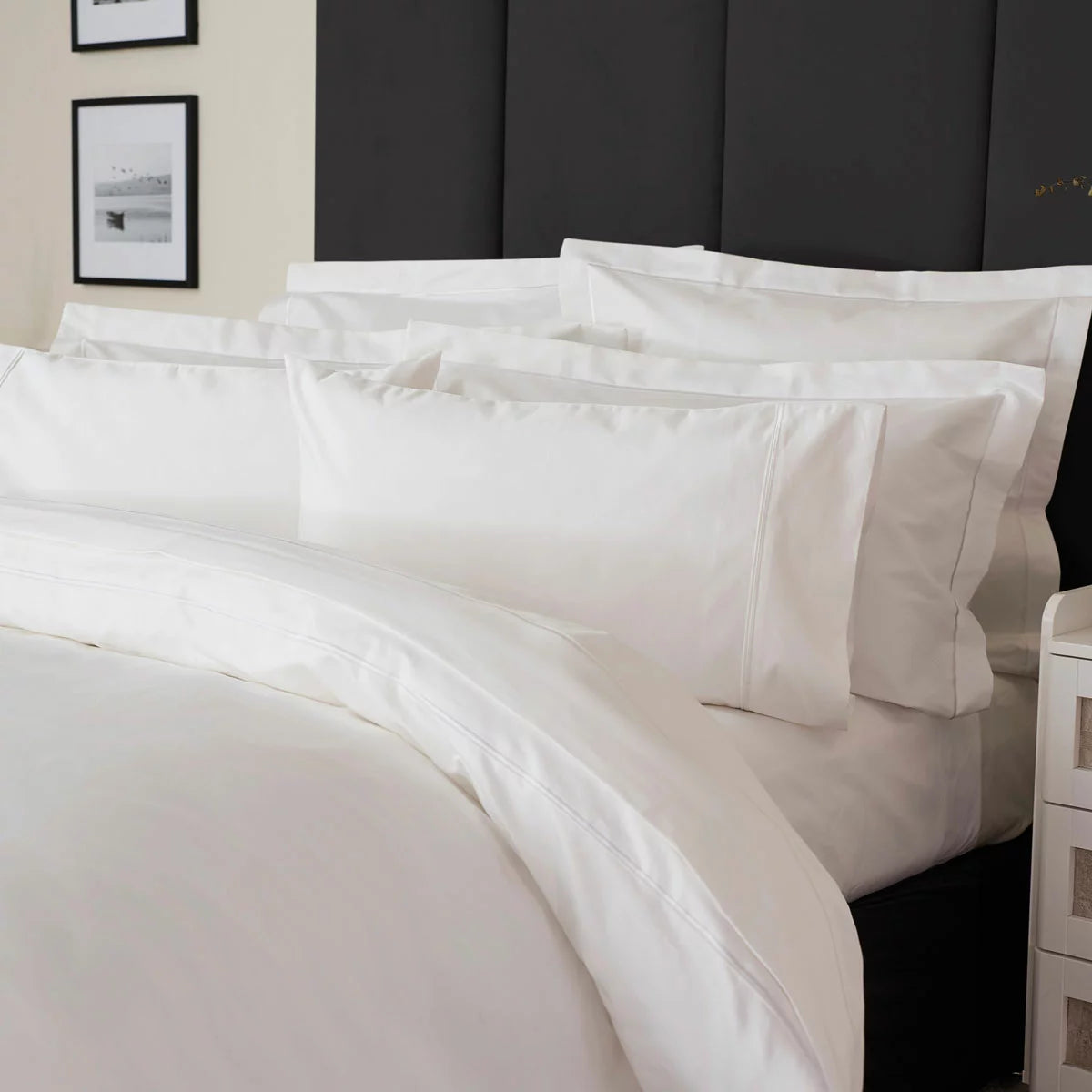 Belledorm 1200 thread count pure white sateen duvet cover styled elegantly on a luxury king size mattress
