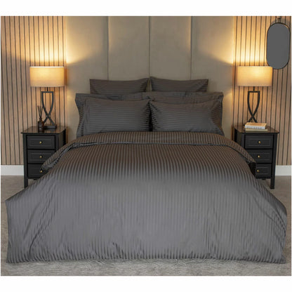 Flat lay of the Belledorm 540 thread count charcoal satin stripe double duvet cover set with matching pillowcases arranged neatly on a modern bed.