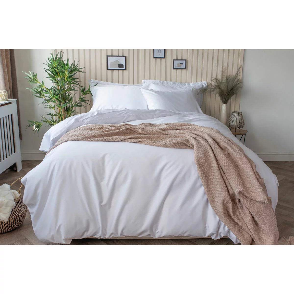Pure white Belledorm bamboo cotton duvet cover set neatly dressed on a bed showing off its smooth, silky finish.